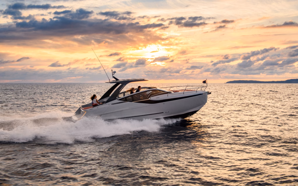 Boat sailing at sunset